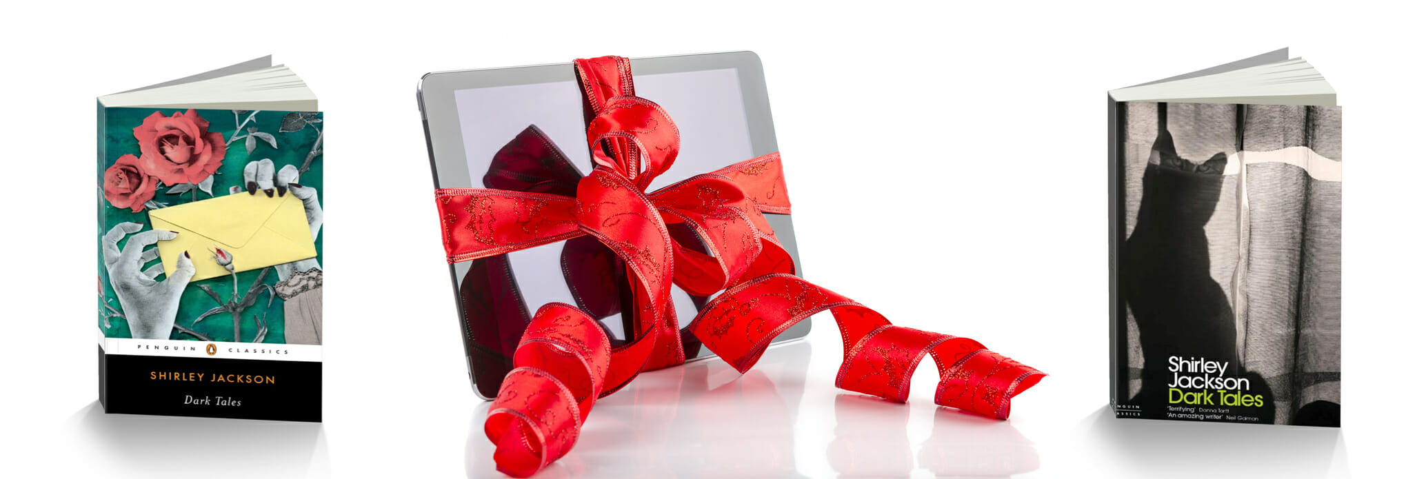 Kindle wrapped in ribbon and two books
